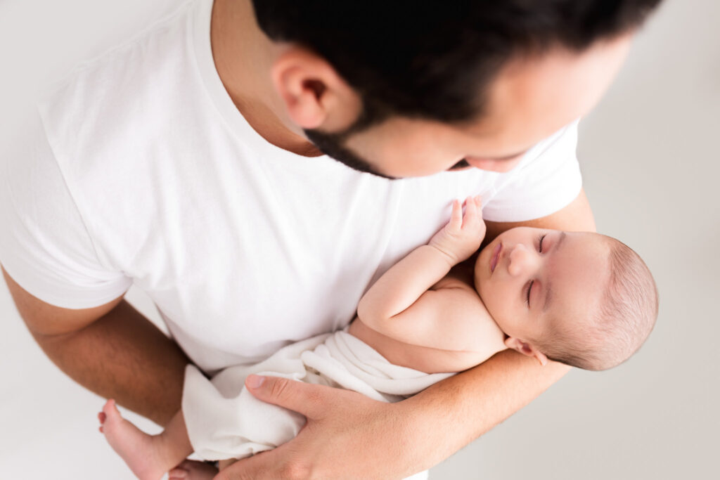 newborn boy in fathers arms indian sacramento sweet jean photography (009)