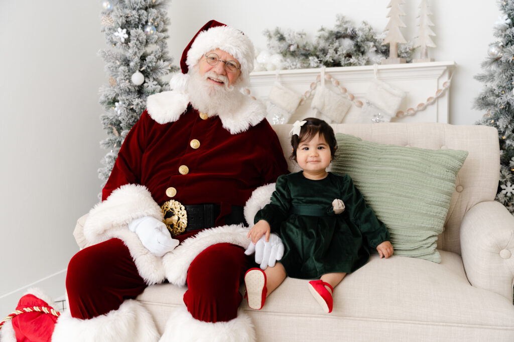 Child meeting Santa during Santa Sessions in Sacramento studio