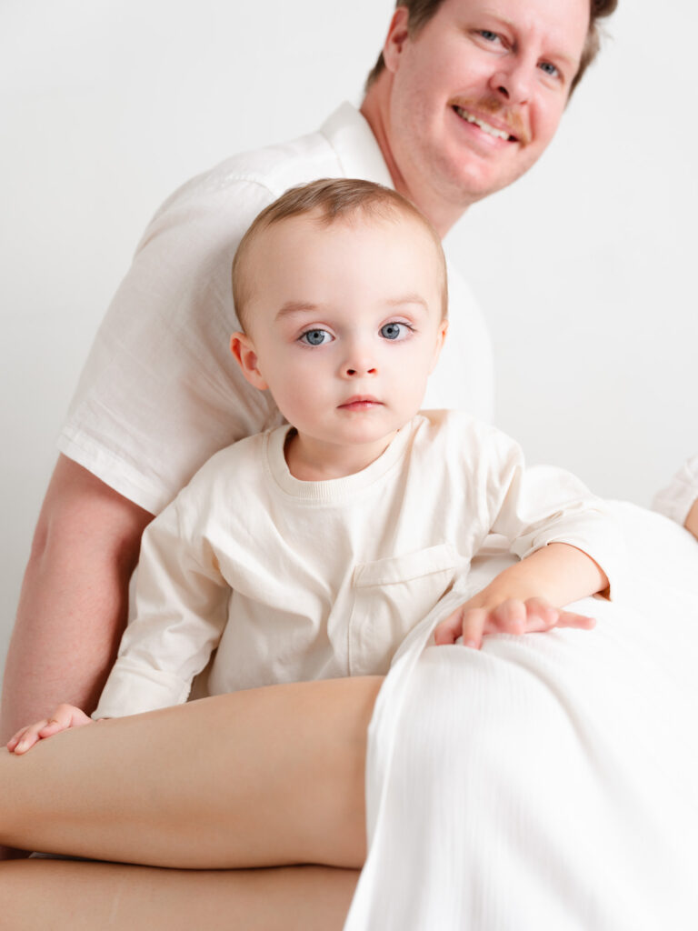 Lifestyle newborn photo with big brother included in Roseville studio