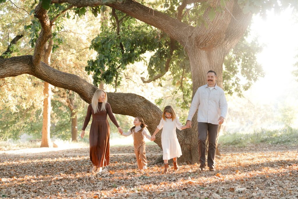 Family walking under a tree Fall Family Photography