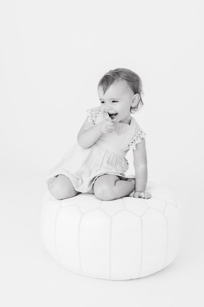 Toddler milestone session, little girl laughing