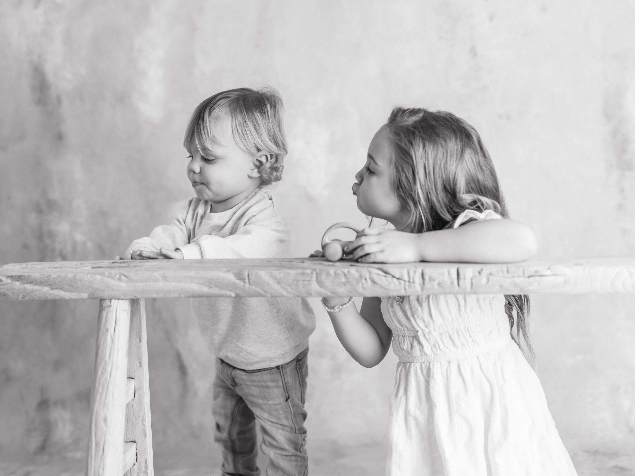 Valentine mini sessions Sacramento Fine art black and white childhood portrait of siblings photographed for The Light Between series in a Sacramento studio
