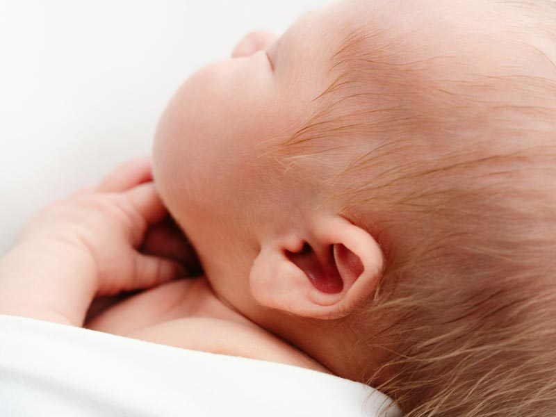 Roseville newborn photographer close up detail of baby&rsquo;s ear during studio session